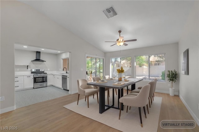 9513 Yucca Blossom Dr, Las Vegas, NV 89134 - dining area with light wood-style flooring, vaulted ceiling, and ceiling fan