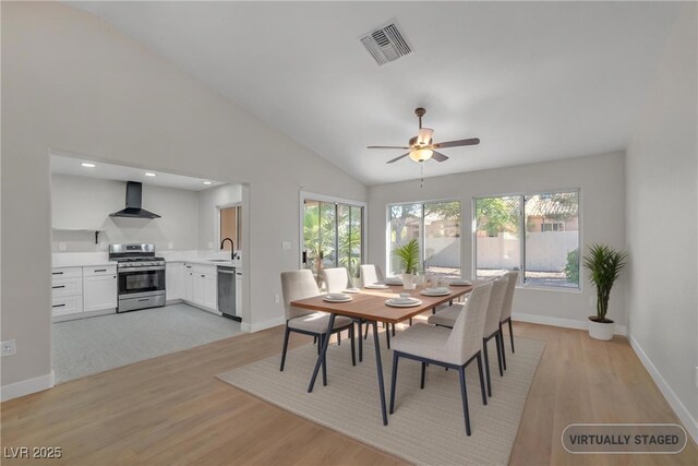 9513 Yucca Blossom Dr, Las Vegas, NV 89134 - dining area featuring light wood-type flooring, lofted ceiling, and a ceiling fan
