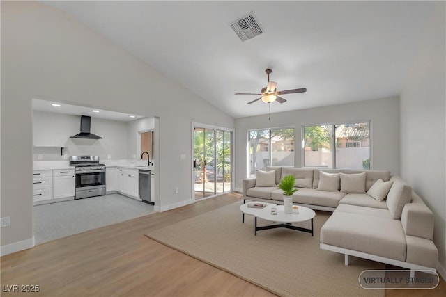 9513 Yucca Blossom Dr, Las Vegas, NV 89134 - living area featuring light wood-type flooring, vaulted ceiling, and ceiling fan