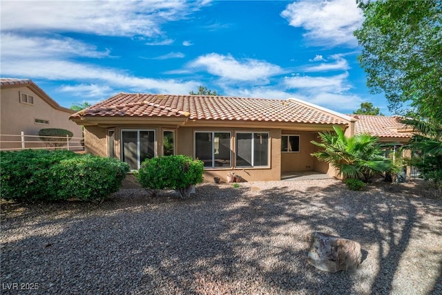 9513 Yucca Blossom Dr, Las Vegas, NV 89134 - rear view of house featuring a tiled roof and stucco siding