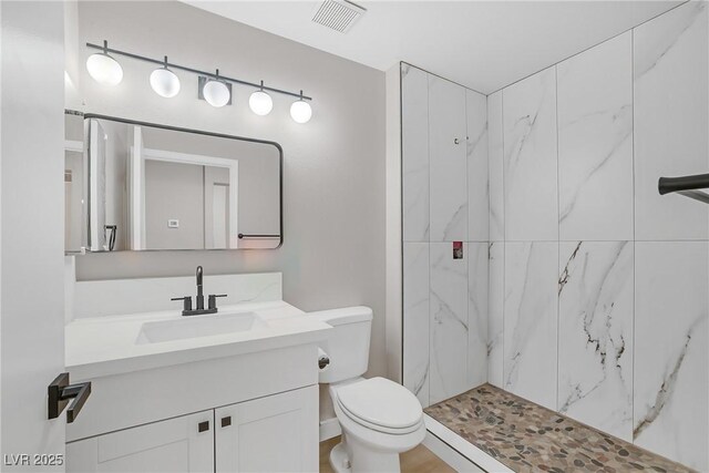9513 Yucca Blossom Dr, Las Vegas, NV 89134 - bathroom featuring vanity and a marble finish shower