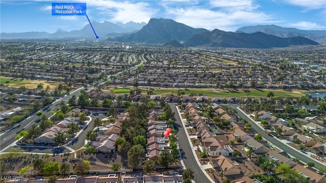 9513 Yucca Blossom Dr, Las Vegas, NV 89134 - aerial perspective of suburban area featuring a mountainous background and a golf club