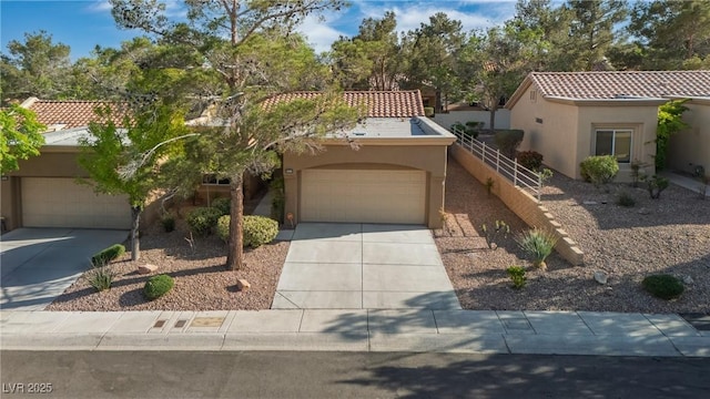 9513 Yucca Blossom Dr, Las Vegas, NV 89134 - mediterranean / spanish-style home with stucco siding, concrete driveway, and a tile roof
