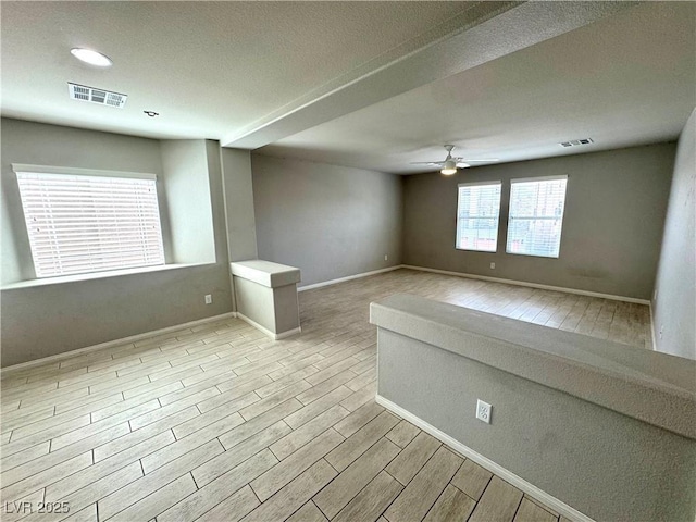 9876 Parador Cellars Ct, Las Vegas, NV 89141 - empty room with a ceiling fan, wood finished floors, a textured ceiling, and recessed lighting