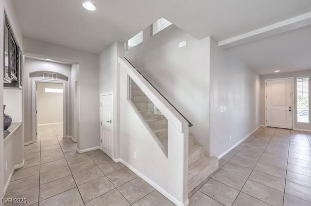 9876 Parador Cellars Ct, Las Vegas, NV 89141 - foyer entrance featuring stairway, light tile patterned floors, recessed lighting, and arched walkways