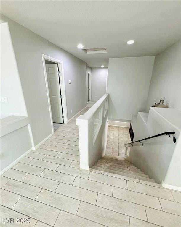 9876 Parador Cellars Ct, Las Vegas, NV 89141 - staircase featuring attic access and recessed lighting