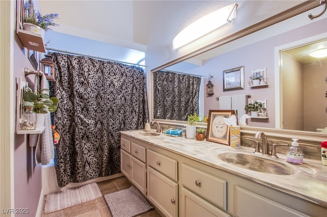 8324 Tide Pool Dr, Las Vegas, NV 89128 - bathroom featuring double vanity, a shower with shower curtain, and tile patterned floors