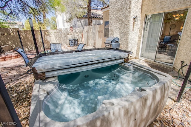 8324 Tide Pool Dr, Las Vegas, NV 89128 - exterior view of stucco siding and a jacuzzi