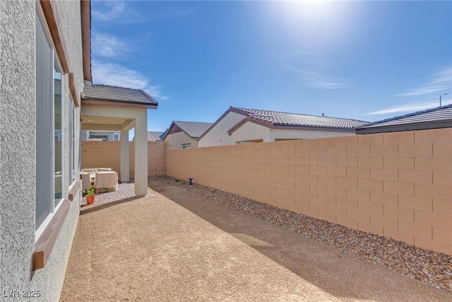 827 Klamath Springs St, Henderson, NV 89011 - fenced backyard with a patio