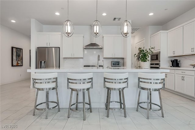 827 Klamath Springs St, Henderson, NV 89011 - kitchen with appliances with stainless steel finishes, light marble finish floors, tasteful backsplash, light countertops, and white cabinets