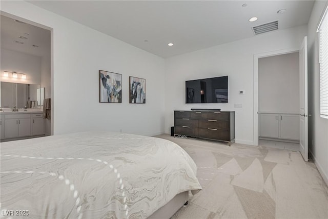 827 Klamath Springs St, Henderson, NV 89011 - bedroom with recessed lighting, ensuite bath, multiple windows, and light carpet