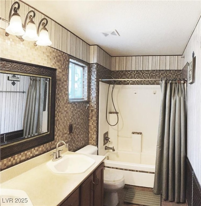 5929 Gentle Creek Ln, North Las Vegas, NV 89031 - bathroom featuring vanity, shower / bath combo with shower curtain, and wallpapered walls