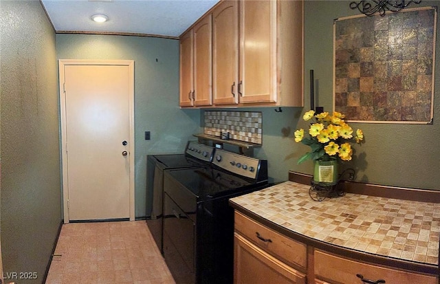 5929 Gentle Creek Ln, North Las Vegas, NV 89031 - washroom featuring cabinet space and washing machine and clothes dryer