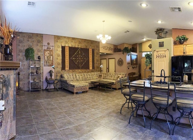 5929 Gentle Creek Ln, North Las Vegas, NV 89031 - tiled living room with lofted ceiling, a chandelier, and recessed lighting