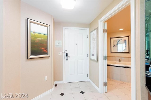 135 E Harmon Ave Unit 2116, Las Vegas, NV 89109 - entryway featuring baseboards and light tile patterned flooring