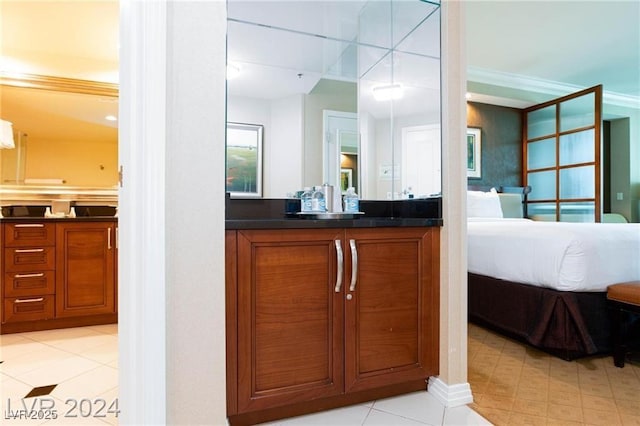 135 E Harmon Ave Unit 2116, Las Vegas, NV 89109 - ensuite bathroom featuring vanity and crown molding