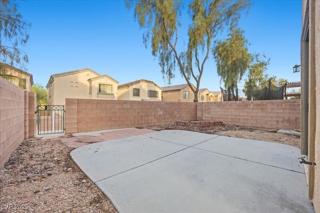 6460 Raven Hall St, North Las Vegas, NV 89084 - fenced backyard featuring a patio area and a gate