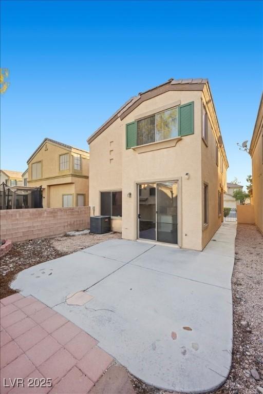 6460 Raven Hall St, North Las Vegas, NV 89084 - back of house featuring stucco siding, a patio, and a fenced backyard
