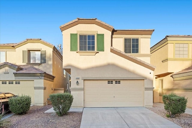 6460 Raven Hall St, North Las Vegas, NV 89084 - view of front of house featuring stucco siding, an attached garage, driveway, and a tiled roof