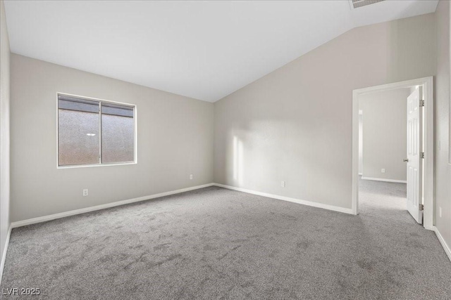 6460 Raven Hall St, North Las Vegas, NV 89084 - carpeted empty room featuring vaulted ceiling and plenty of natural light
