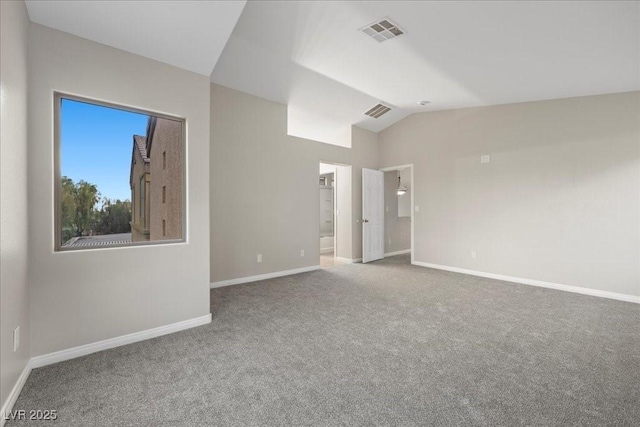 6460 Raven Hall St, North Las Vegas, NV 89084 - spare room featuring carpet floors and vaulted ceiling