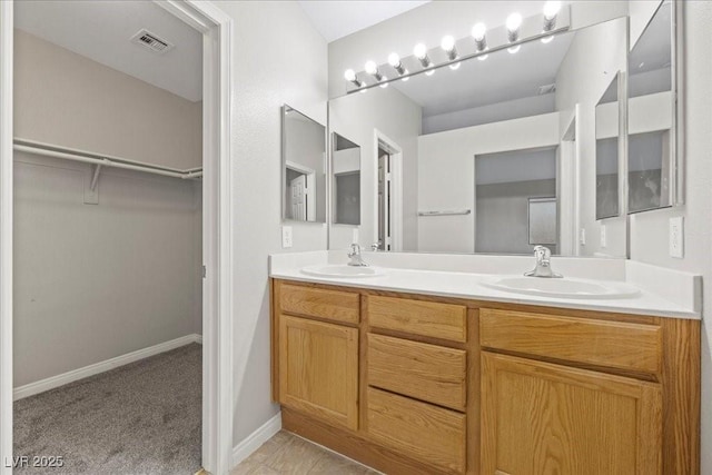 6460 Raven Hall St, North Las Vegas, NV 89084 - bathroom with double vanity and a spacious closet