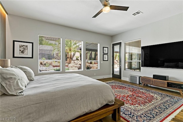 1509 Winslow St, Las Vegas, NV 89117 - bedroom with wood finished floors, access to outside, and a ceiling fan
