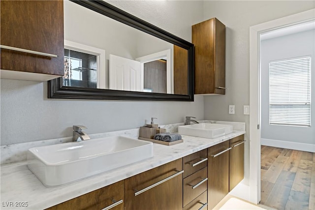 1509 Winslow St, Las Vegas, NV 89117 - bathroom featuring double vanity and wood finished floors