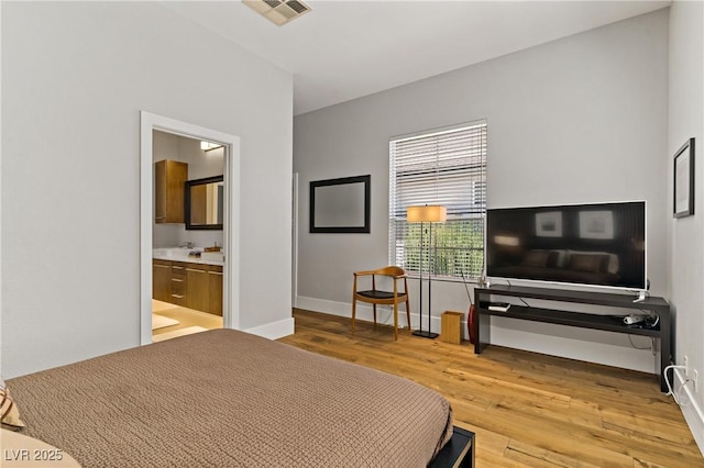 1509 Winslow St, Las Vegas, NV 89117 - bedroom with wood finished floors and ensuite bath
