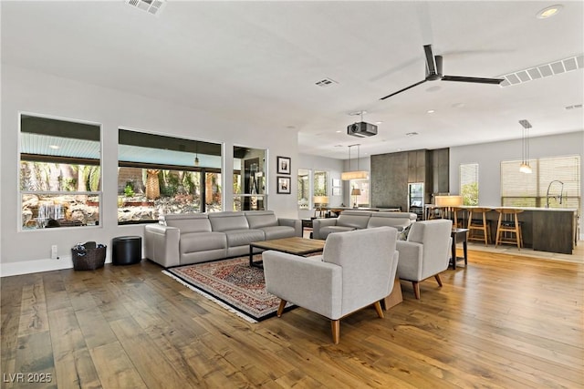 1509 Winslow St, Las Vegas, NV 89117 - living area with wood-type flooring, a ceiling fan, and recessed lighting