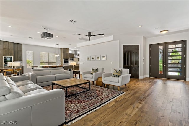1509 Winslow St, Las Vegas, NV 89117 - living area featuring wine cooler, healthy amount of natural light, wood-type flooring, and recessed lighting