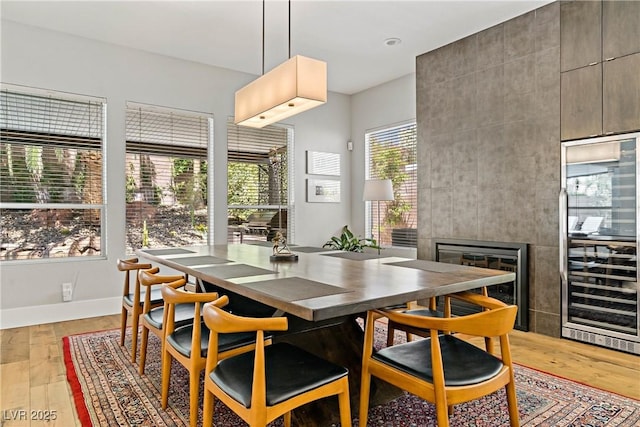 1509 Winslow St, Las Vegas, NV 89117 - dining room featuring beverage cooler, healthy amount of natural light, and light wood-style floors