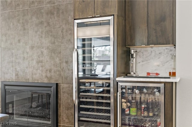 1509 Winslow St, Las Vegas, NV 89117 - bar with wine cooler and a glass covered fireplace