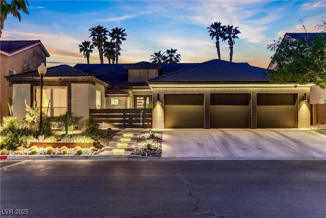 1509 Winslow St, Las Vegas, NV 89117 - view of front of property with a garage, concrete driveway, and stucco siding