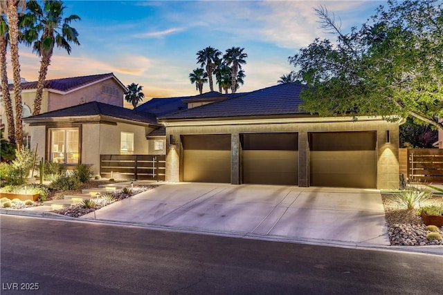 1509 Winslow St, Las Vegas, NV 89117 - view of front facade featuring concrete driveway, an attached garage, and stucco siding