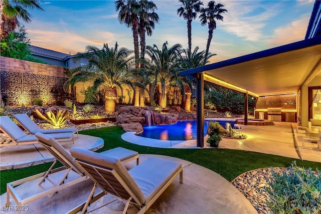 1509 Winslow St, Las Vegas, NV 89117 - fenced backyard with area for grilling, a patio area, and an outdoor pool