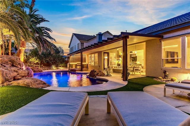 1509 Winslow St, Las Vegas, NV 89117 - pool at dusk with a patio and an outdoor pool