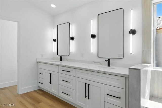 2105 Madagascar Ln, Las Vegas, NV 89117 - bathroom featuring double vanity and wood finished floors