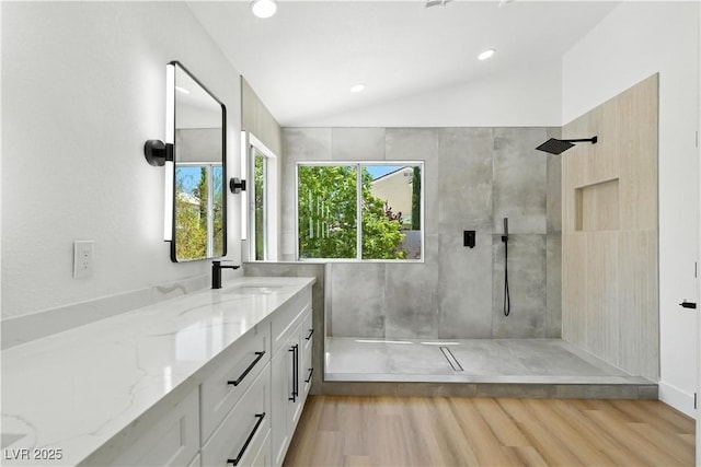 2105 Madagascar Ln, Las Vegas, NV 89117 - bathroom with vanity, walk in shower, vaulted ceiling, recessed lighting, and wood finished floors
