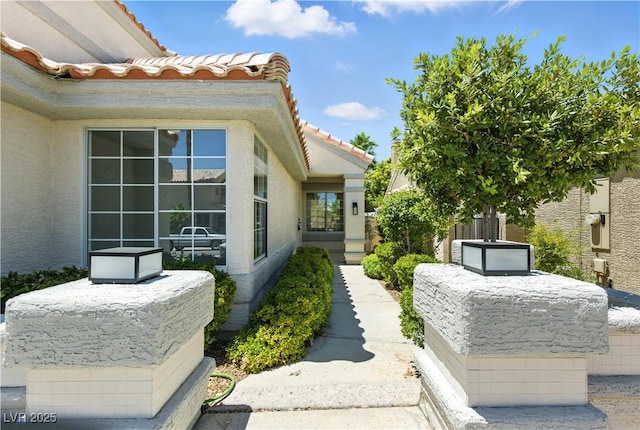 2105 Madagascar Ln, Las Vegas, NV 89117 - view of side of property featuring a tiled roof and stucco siding