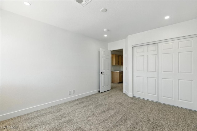 2105 Madagascar Ln, Las Vegas, NV 89117 - unfurnished bedroom featuring light carpet, recessed lighting, and a closet