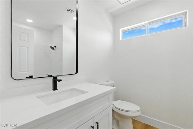 2105 Madagascar Ln, Las Vegas, NV 89117 - bathroom featuring vanity, wood finished floors, recessed lighting, and a shower