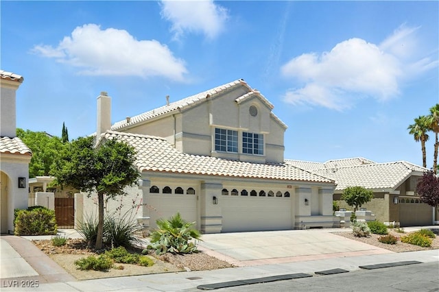 2105 Madagascar Ln, Las Vegas, NV 89117 - mediterranean / spanish house featuring driveway, a tiled roof, stucco siding, and a chimney