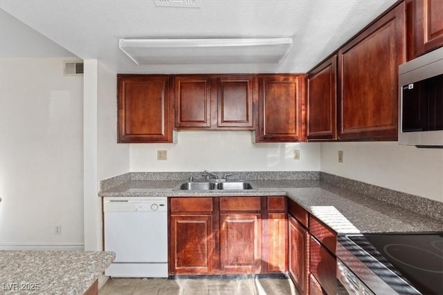 5200 Indian River Dr Unit 301, Las Vegas, NV 89103 - kitchen featuring dishwasher, stainless steel microwave, and stovetop