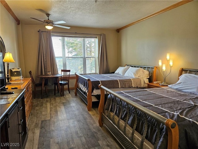 223 Hunter Ridge Rd Unit 121, Brian Head, UT 84719 - bedroom featuring dark wood-style floors, crown molding, and a textured ceiling