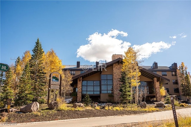 223 Hunter Ridge Rd Unit 121, Brian Head, UT 84719 - view of front of house featuring a chimney and stucco siding