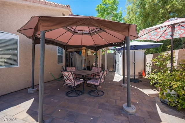 9632 Spanish Steps Ln, Las Vegas, NV 89117 - view of patio featuring a storage shed, outdoor dining area, and a gazebo