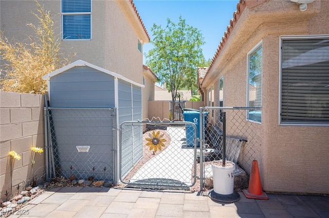 9632 Spanish Steps Ln, Las Vegas, NV 89117 - view of home's exterior featuring a gate and stucco siding