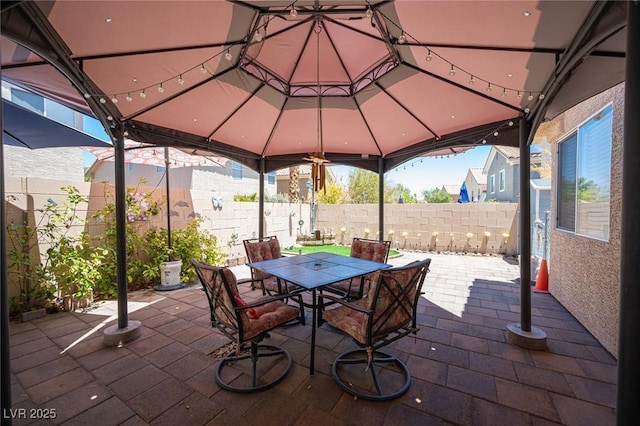 9632 Spanish Steps Ln, Las Vegas, NV 89117 - fenced backyard featuring outdoor dining space, a patio, and a gazebo