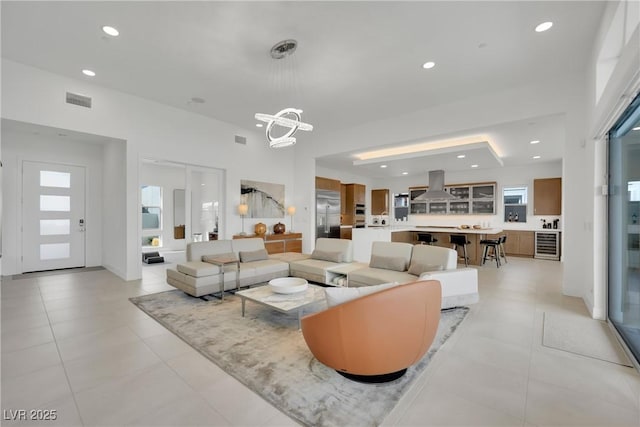 818 Calluna St, Las Vegas, NV 89138 - living area with wine cooler, a chandelier, recessed lighting, and light tile patterned floors
